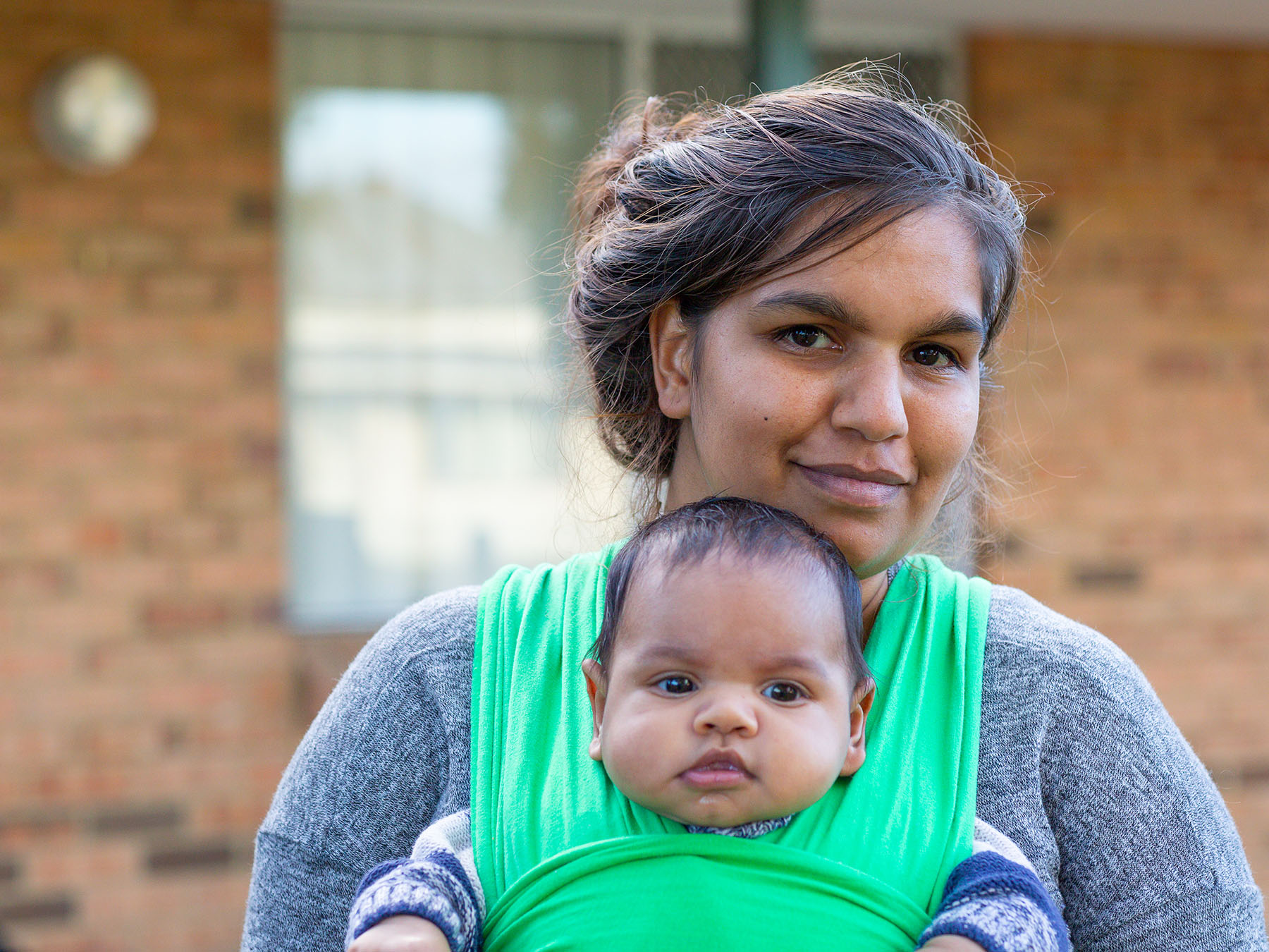 Mother standing with a newborn baby