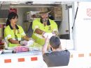 Emergency service volunteers providing food to people who need it. 