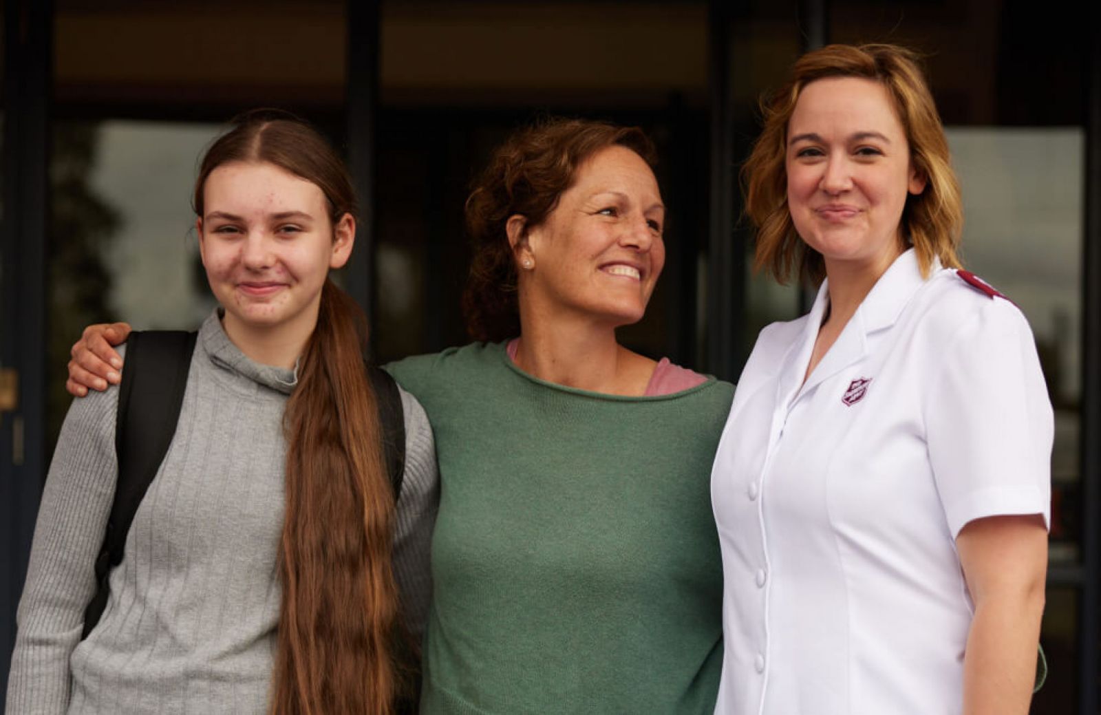 A mother and daughter celebrate Christmas with a Salvation Army officer