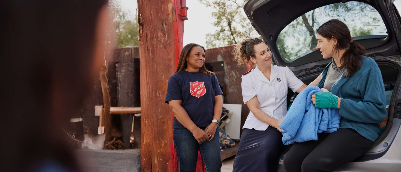 Salvos personnel helping a community member in need