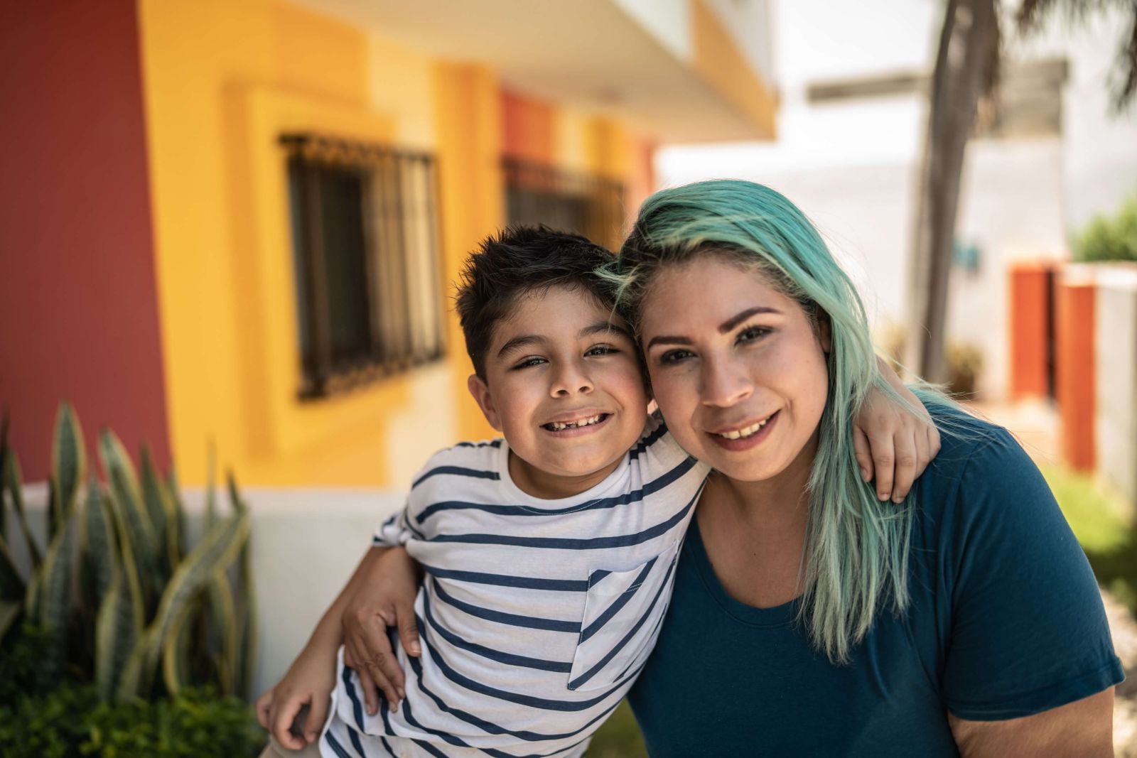 Mother and son smiling together.