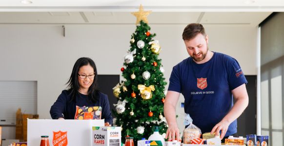 Salvos team members wrapping Christmas presents