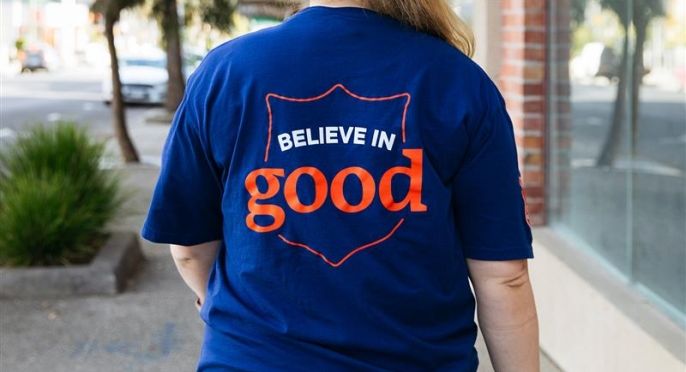 A Salvos worker wearing a Believe in Good shirt