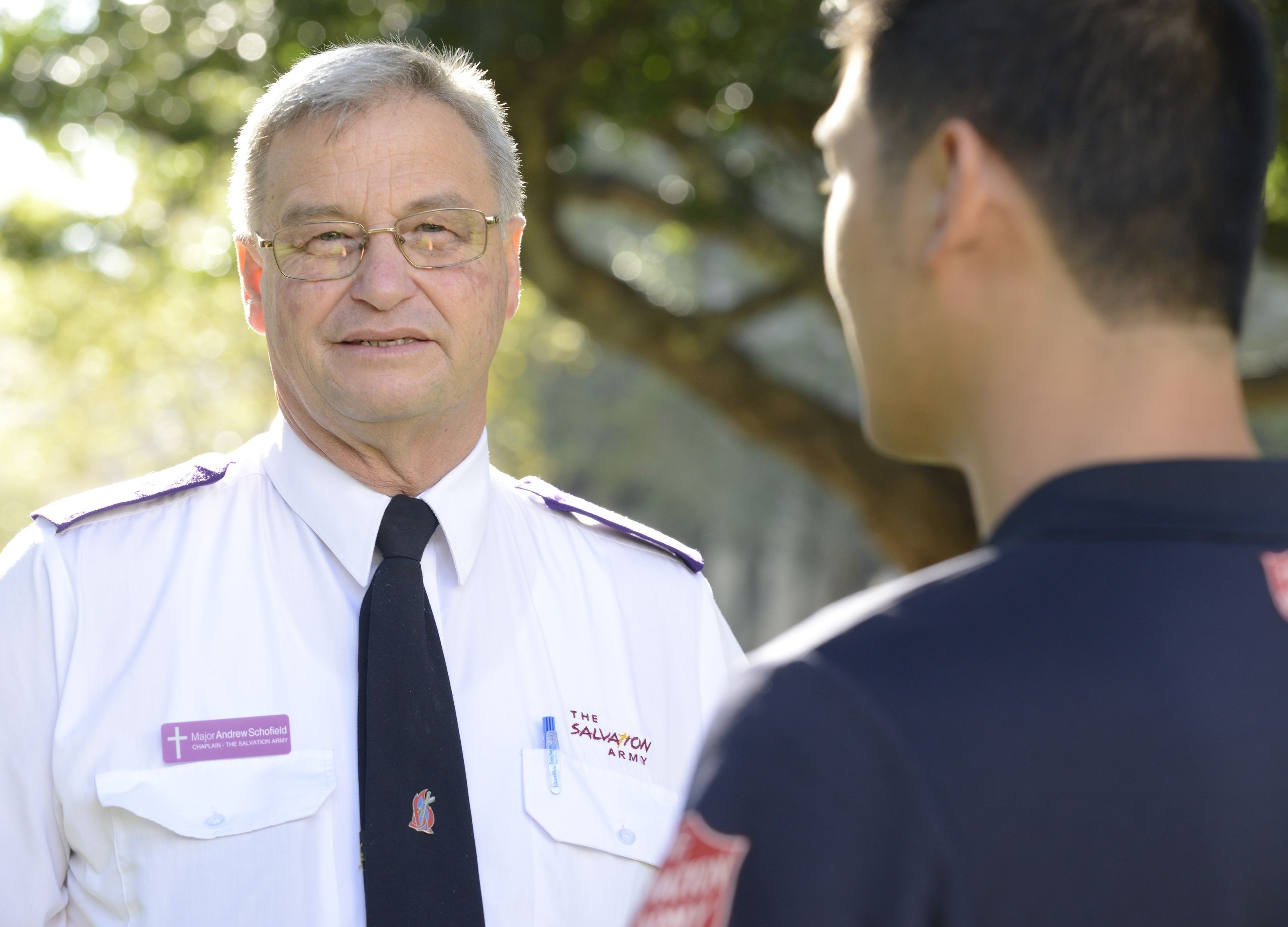 Chaplain Andrew discussing with a team member