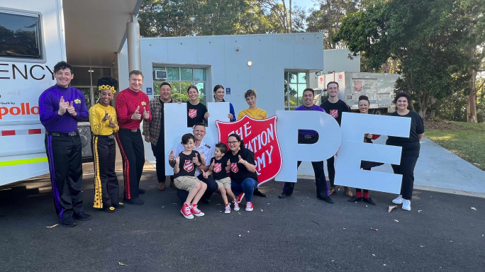 The Wiggles, Corps Officers Donna and Phil Sutcliffe, and emergency services outside