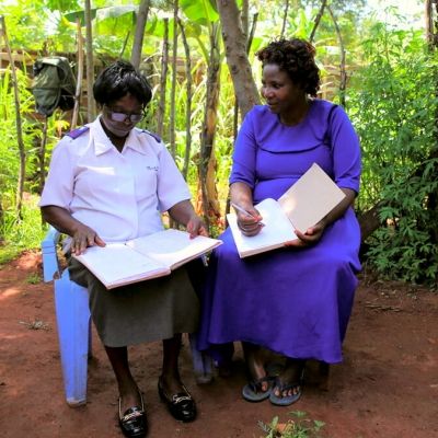 Rose and Gladys with workbooks - Kenya