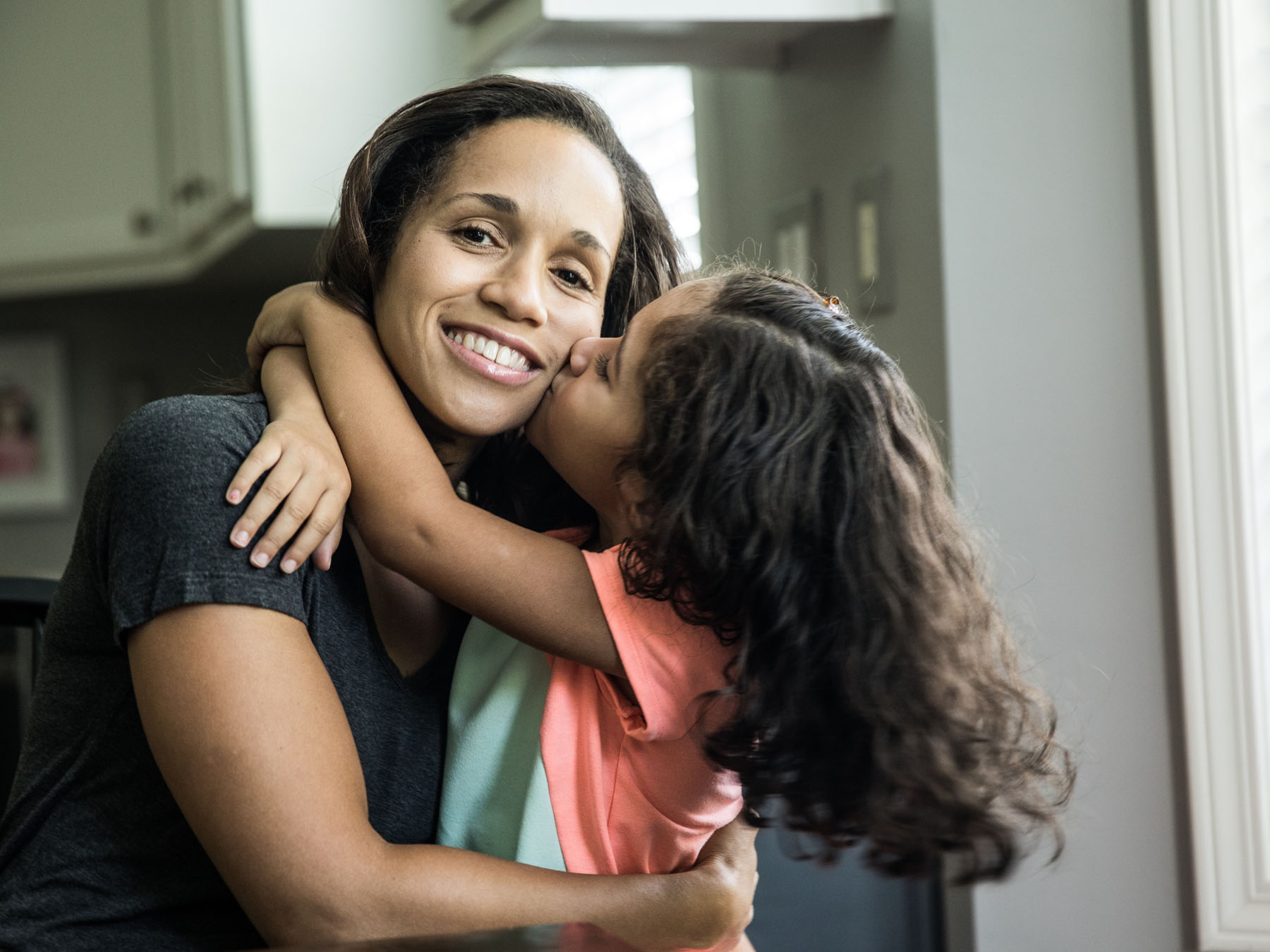 Sophia hugging her daughter