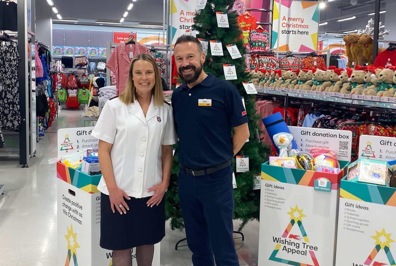 Salvos personnel with Kmart employee