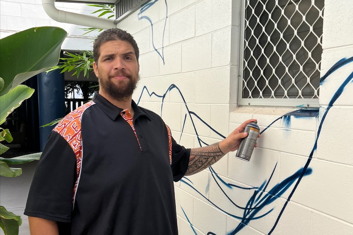 Phillip Buatava helping to promote a local Salvos art exhibition.