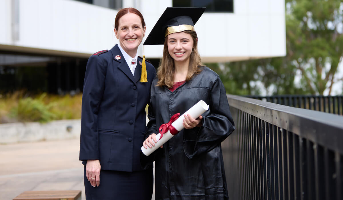 Ava smiling in her graduation gown