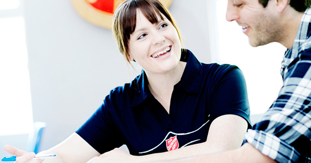 Salvos Caseworker helping young man with a financial counselling program