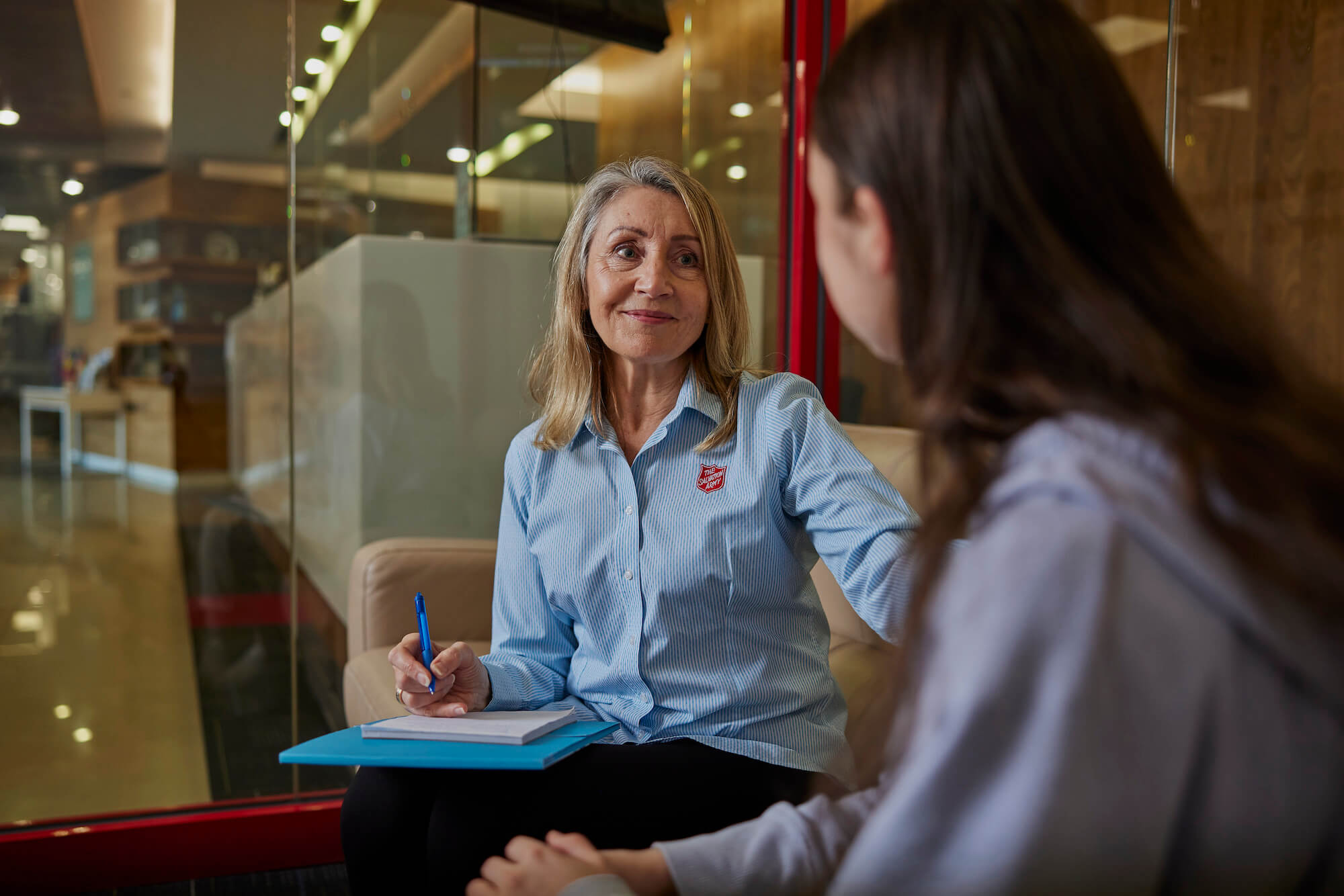 Salvos officer offering support to a domestic violence victim