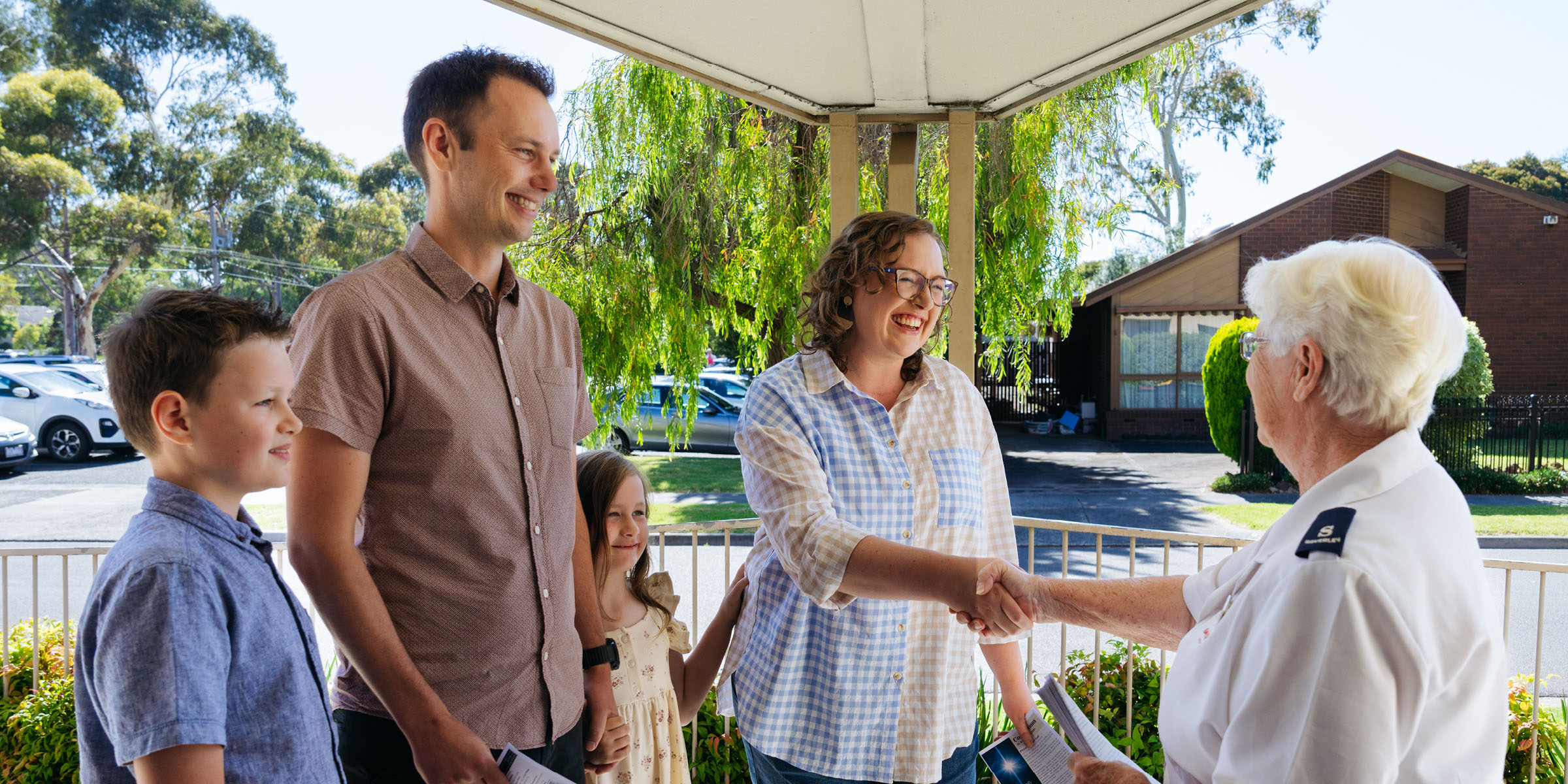 Salvos officer with a family